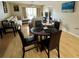Open floor plan with dining table and chairs near a living room with plush couches at 220 Cypress Ln # 220, Oldsmar, FL 34677