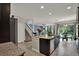 Spacious eat in kitchen features a large kitchen island and granite countertops at 22368 Woodmen Hall Dr, Land O Lakes, FL 34637