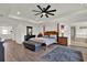 Large main bedroom with hardwood floors, ceiling fan and natural light at 22368 Woodmen Hall Dr, Land O Lakes, FL 34637