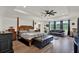 Spacious main bedroom with hardwood floors, sofa, ceiling fan and natural light at 22368 Woodmen Hall Dr, Land O Lakes, FL 34637