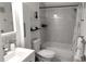 Contemporary bathroom with a bathtub and shower, clean white tiles, and stylish fixtures, creating a spa-like experience at 2261 Swedish Dr # 59, Clearwater, FL 33763