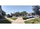 Beautiful building with well-maintained landscaping, ample parking, and a prominent American flag, exuding community pride at 2261 Swedish Dr # 59, Clearwater, FL 33763