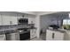 Modern kitchen features stainless steel appliances, granite countertops, and ample cabinet space at 2261 Swedish Dr # 59, Clearwater, FL 33763