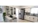 Stylish eat-in kitchen with a stainless steel refrigerator and marble countertops at 2261 Swedish Dr # 59, Clearwater, FL 33763