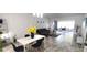 Open-concept living and dining area with stylish furnishings and plenty of natural light at 2261 Swedish Dr # 59, Clearwater, FL 33763