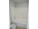 Clean, well-maintained bathroom featuring a shower-tub combination and neutral-toned fixtures at 24741 Ravello St, Land O Lakes, FL 34639