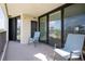 Relaxing balcony with seating overlooking lush landscaping and water views at 2530 Gary Cir # 301, Dunedin, FL 34698