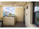 Balcony with stucco walls, a dark floor, and a pleasant view of the area at 2530 Gary Cir # 301, Dunedin, FL 34698
