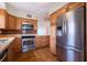 Bright kitchen featuring stainless steel appliances and plenty of cabinet space at 2530 Gary Cir # 301, Dunedin, FL 34698