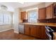 Charming kitchen featuring modern appliances, ample cabinet space, and a view of the outside at 2530 Gary Cir # 301, Dunedin, FL 34698