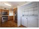 Well-equipped kitchen with stainless steel appliances and a convenient in-unit laundry area at 2530 Gary Cir # 301, Dunedin, FL 34698