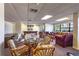 Spacious lounge area with pool table, sofas, chairs and tables, designed for social gatherings and relaxation at 2530 Gary Cir # 301, Dunedin, FL 34698