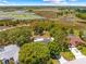 Aerial view of the property showcasing the home, pool, and surrounding landscape at 3041 Waterfall Dr, Spring Hill, FL 34608