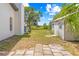 Spacious backyard with a shed and mature trees, perfect for outdoor activities at 3041 Waterfall Dr, Spring Hill, FL 34608
