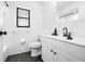 Modern bathroom with white subway tile, black accents, and a sleek vanity at 3041 Waterfall Dr, Spring Hill, FL 34608