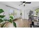 Bright home office/bedroom with ample natural light and wood-look flooring at 3041 Waterfall Dr, Spring Hill, FL 34608