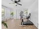 Home office/bedroom featuring a workstation, a modern chair, and a ceiling fan at 3041 Waterfall Dr, Spring Hill, FL 34608