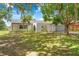 Charming single-story home featuring a well-manicured lawn, arched entry, and attached two-car garage at 3041 Waterfall Dr, Spring Hill, FL 34608