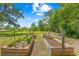 Image highlighting the raised garden beds in the backyard of the property at 3041 Waterfall Dr, Spring Hill, FL 34608