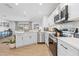 Charming eat-in kitchen with quartz countertops, stainless steel appliances, and bright decor at 3041 Waterfall Dr, Spring Hill, FL 34608