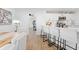 A bright interior with a bar-style kitchen counter and views of an office space at 3041 Waterfall Dr, Spring Hill, FL 34608