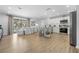 A modern kitchen flows seamlessly into the dining and living area for open concept living at 3041 Waterfall Dr, Spring Hill, FL 34608