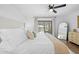 Bright main bedroom with a view of the outdoor pool area at 3041 Waterfall Dr, Spring Hill, FL 34608