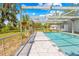 Screened-in pool area with a view of the yard, offering privacy and relaxation for outdoor enjoyment at 3041 Waterfall Dr, Spring Hill, FL 34608