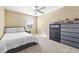 Bright bedroom with neutral walls, carpet flooring, ceiling fan, and natural light at 3071 Marine Grass Dr, Wimauma, FL 33598