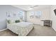 Relaxing bedroom featuring neutral decor, natural light and a dedicated desk area at 3071 Marine Grass Dr, Wimauma, FL 33598