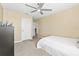 Bright bedroom with neutral walls, carpet flooring, and a ceiling fan at 3071 Marine Grass Dr, Wimauma, FL 33598