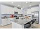 Stylish kitchen with granite countertops, stainless steel appliances, and ample cabinet space at 3071 Marine Grass Dr, Wimauma, FL 33598