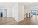 Upstairs living space with hardwood floors and plenty of natural light at 3071 Marine Grass Dr, Wimauma, FL 33598