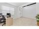 Bright home office with tiled floors, large windows, and an open entryway at 3071 Marine Grass Dr, Wimauma, FL 33598