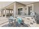 Covered outdoor kitchen with built-in grill and bar area, great for entertaining at 3071 Marine Grass Dr, Wimauma, FL 33598