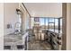 Stylish outdoor kitchen with stone finishes, stainless steel appliances, and a sink at 3071 Marine Grass Dr, Wimauma, FL 33598