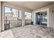 Covered outdoor patio with sleek pavers, providing a perfect blend of indoor-outdoor living at 3071 Marine Grass Dr, Wimauma, FL 33598