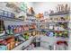 Walk-in pantry features wire shelving, providing ample storage space for groceries and household items at 3071 Marine Grass Dr, Wimauma, FL 33598