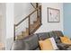 Staircase features wood steps and modern railings, providing a stylish transition to upper floors at 3071 Marine Grass Dr, Wimauma, FL 33598