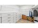 Spacious walk-in closet with built-in shelving and drawers for optimal organization at 3071 Marine Grass Dr, Wimauma, FL 33598
