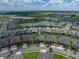 Aerial view of homes in a Gathering-friendly neighborhood, close to a tranquil lake with picturesque surroundings at 31510 Cabana Rye Ave, San Antonio, FL 33576