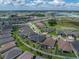 Aerial view of a lovely neighborhood with well-maintained homes, green lawns, and lush landscaping at 31510 Cabana Rye Ave, San Antonio, FL 33576