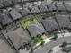 Aerial view shows a lovely home with well-maintained landscaping and a charming brick driveway in a desirable community at 31510 Cabana Rye Ave, San Antonio, FL 33576
