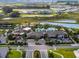Wide aerial shot of the clubhouse, showing amenities, landscaping, and the surrounding Mirada community at 31510 Cabana Rye Ave, San Antonio, FL 33576