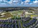 Gorgeous aerial view of a Primary-planned community complete with lakes, tennis courts, and lush landscaping at 31510 Cabana Rye Ave, San Antonio, FL 33576