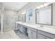 Luxurious bathroom featuring double sinks, a glass shower, and modern fixtures at 31510 Cabana Rye Ave, San Antonio, FL 33576