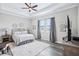 Serene bedroom featuring wood floors and tray ceiling at 31510 Cabana Rye Ave, San Antonio, FL 33576
