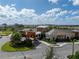 Aerial view of the stunning Medley at Mirada clubhouse featuring lush landscaping and a grand entrance at 31510 Cabana Rye Ave, San Antonio, FL 33576