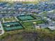 Aerial view showcasing the tennis courts, playground, and residential area within the community at 31510 Cabana Rye Ave, San Antonio, FL 33576