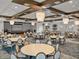 Large community room featuring round tables and chairs, modern chandeliers, and stage at 31510 Cabana Rye Ave, San Antonio, FL 33576
